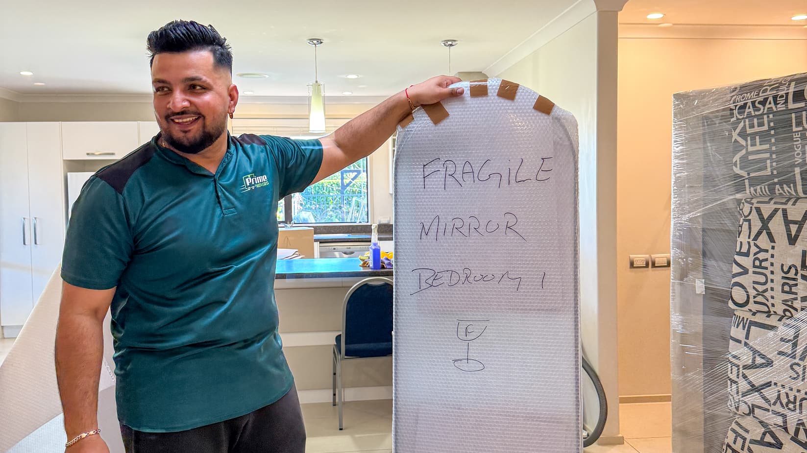 Team member holding a packed mirror