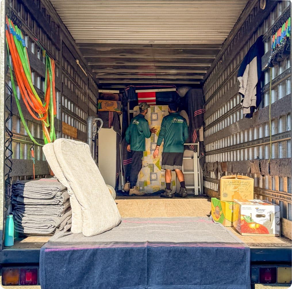 Team members stacking stuff in a truck
